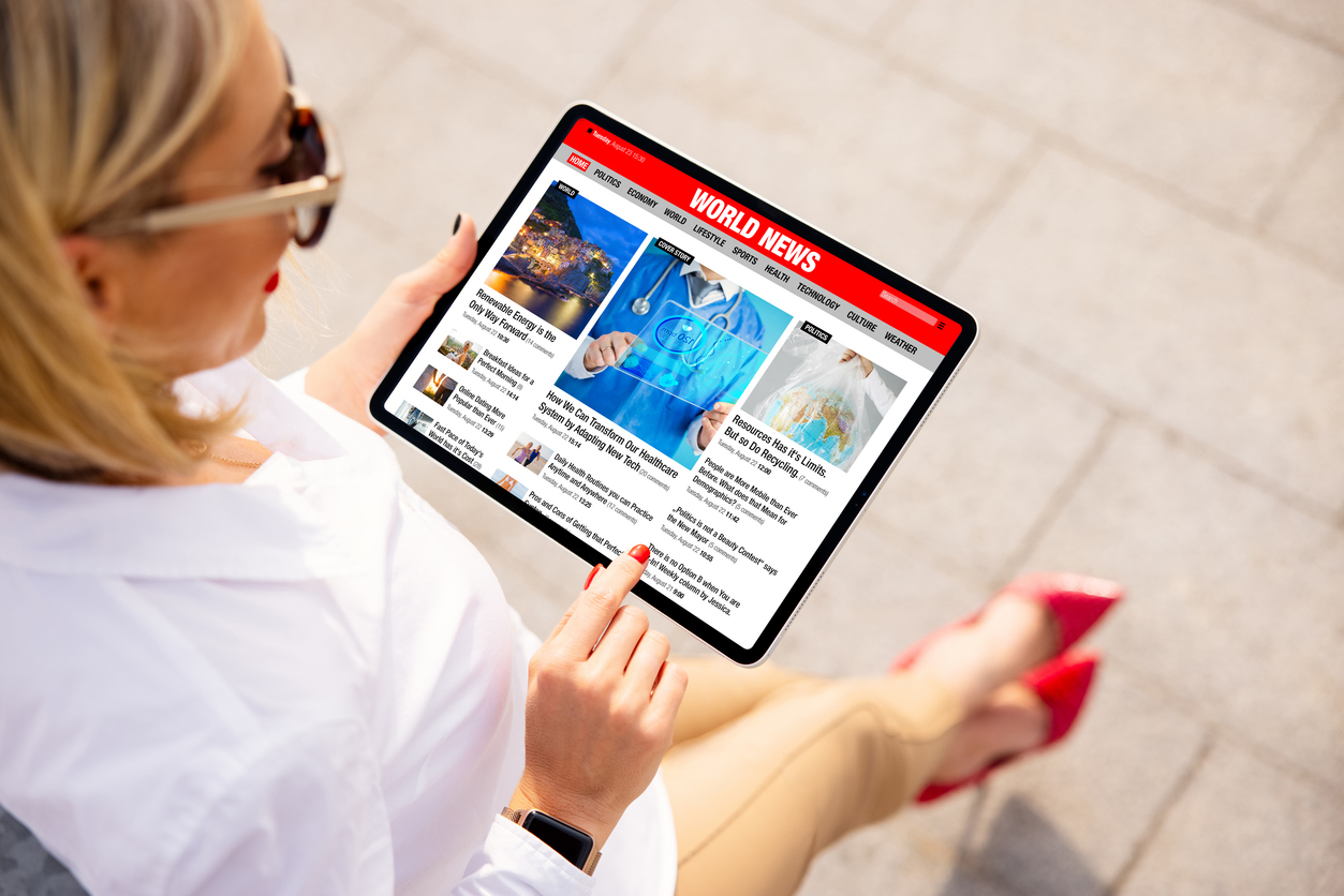 Woman reading top-tier media